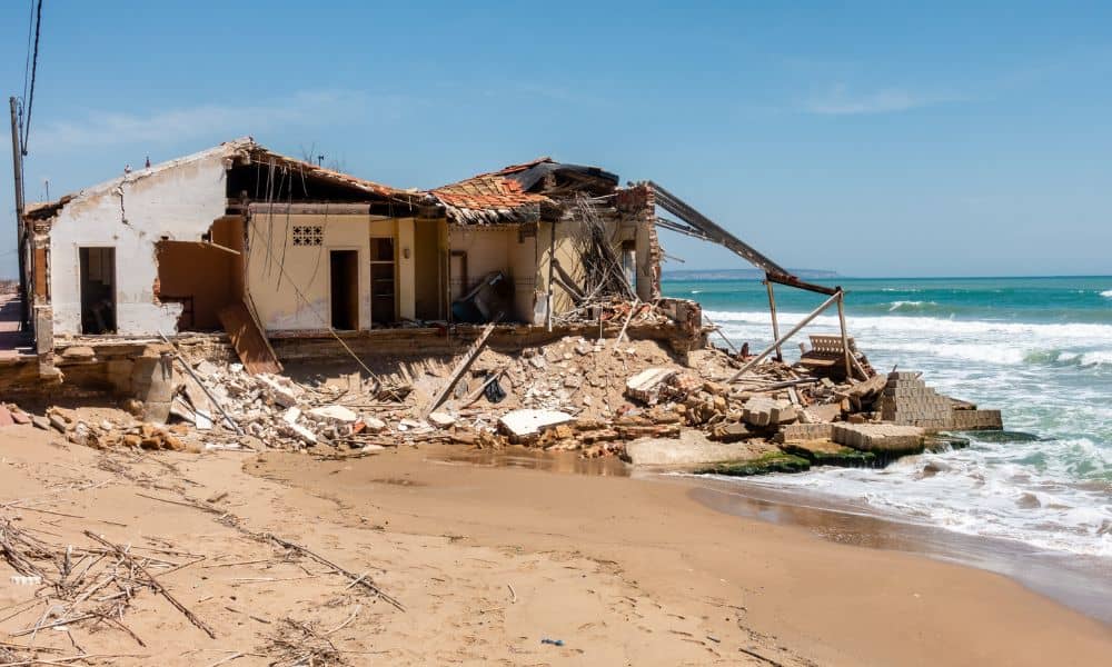 Collapsed beach home showing severe erosion and why an elevation survey matters