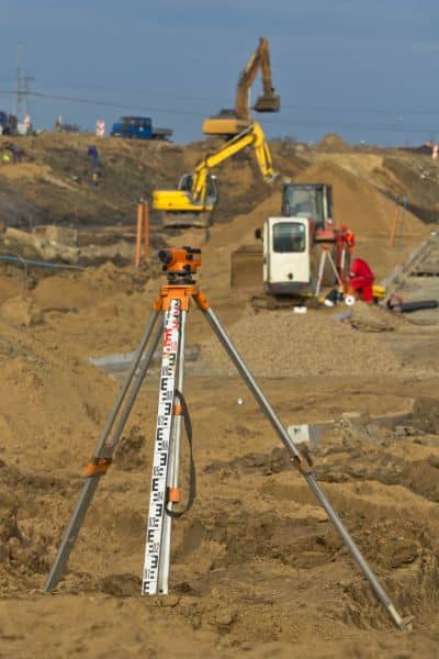 Construction site surveying equipment - ALTA SURVEY North Carolina Surveying equipment set up on a construction site to capture elevation data for a topographic survey