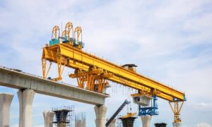 Civil engineers working on a modern transit construction site, showing how large infrastructure projects rely on detailed traffic study planning