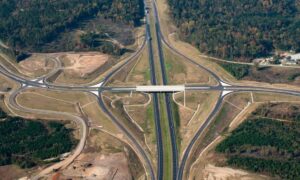 Highway interchange aerial - ALTA SURVEY North Carolina Aerial view of a highway interchange surrounded by expanding land development and cleared construction site
