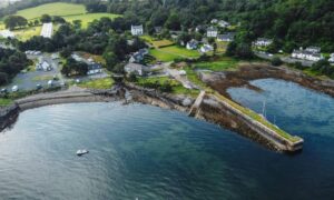 Aerial coastal view showing shoreline and land changes used in a topographic survey