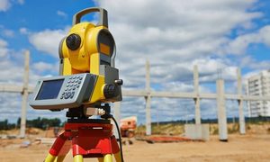 Total station used for a construction staking survey at an active construction site