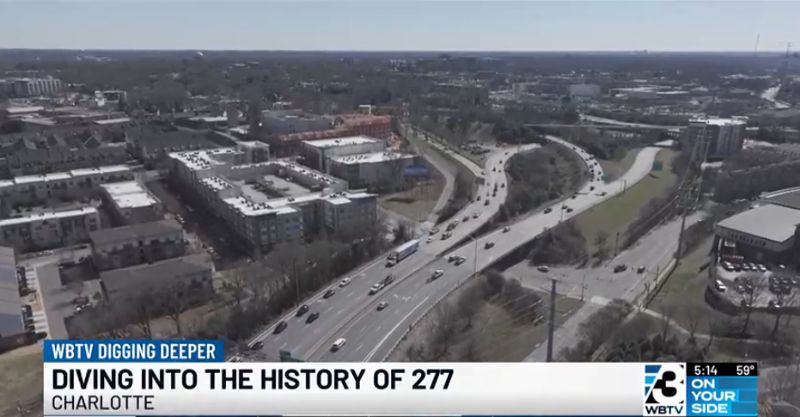 Aerial view of the I-277 shutdown in Charlotte with traffic rerouted, highlighting the importance of a construction survey for planning road projects