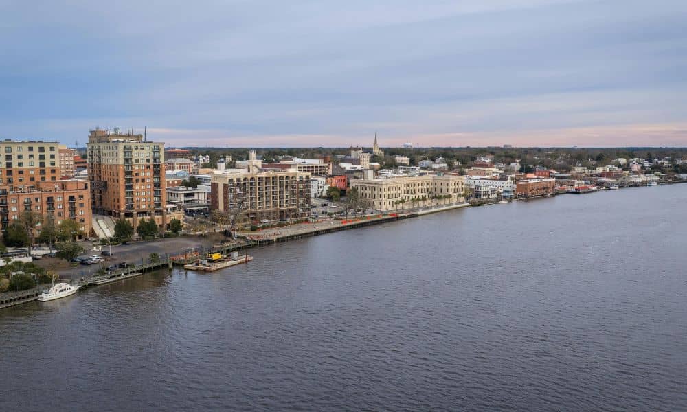 Wilmington's waterfront with coastal homes, highlighting the importance of a FEMA elevation certificate for flood risk assessment.
