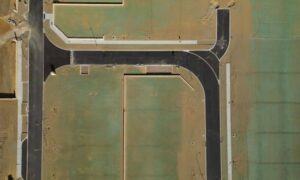 Aerial view of residential lots and roads showing the property layout for a mortgage survey