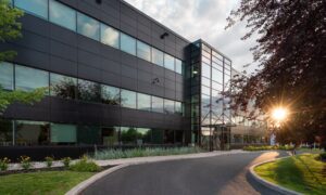 Office building and driveway at an existing commercial property, illustrating the site conditions considered in ALTA survey requirements